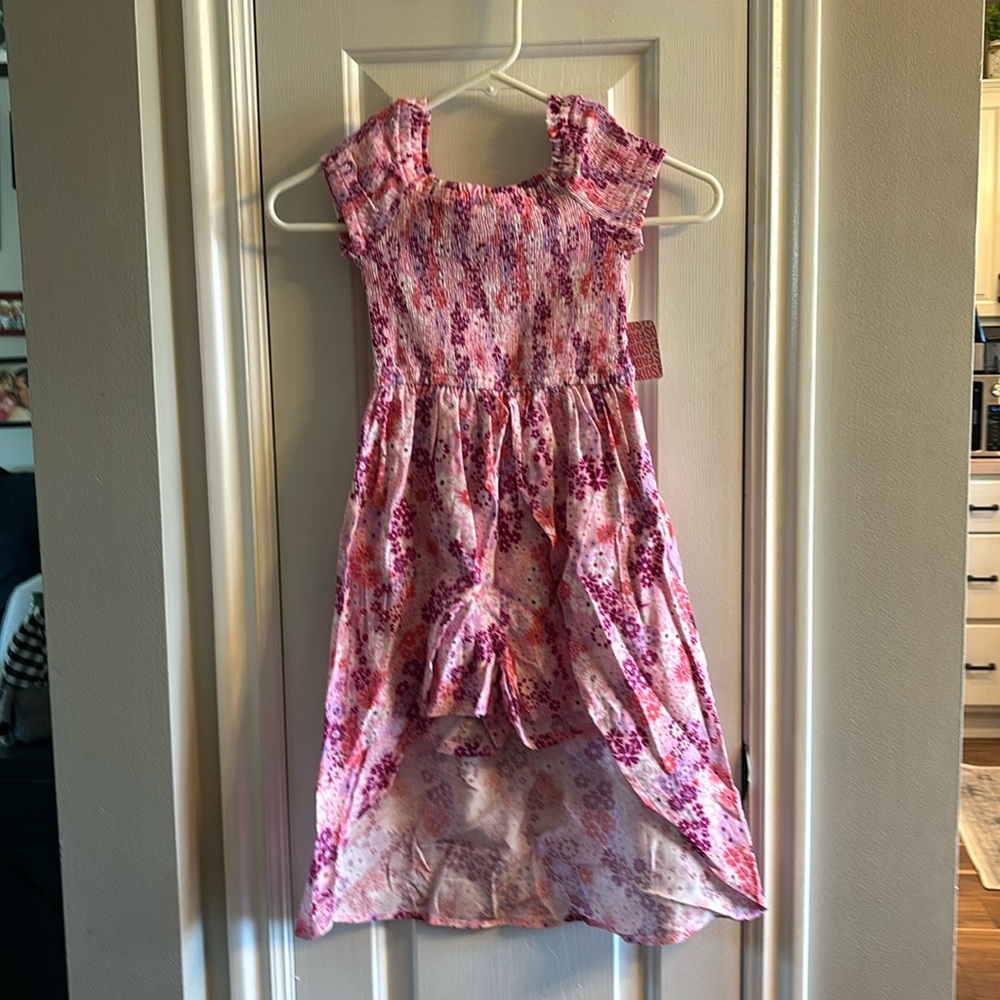 One piece short set with long skirt in the back.
